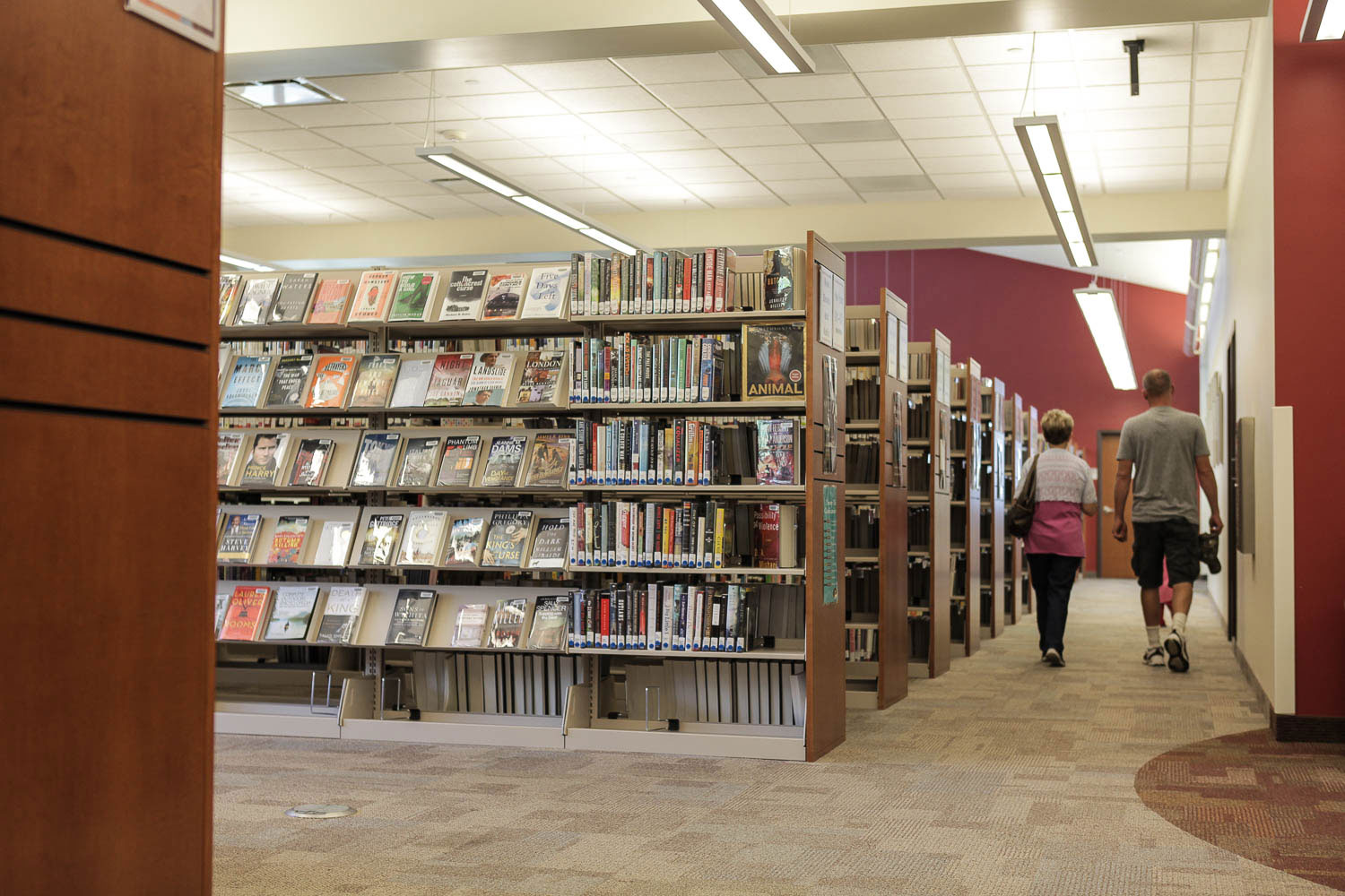 Library Storage - cantilever shelving with custom end panels at Uintah County Library