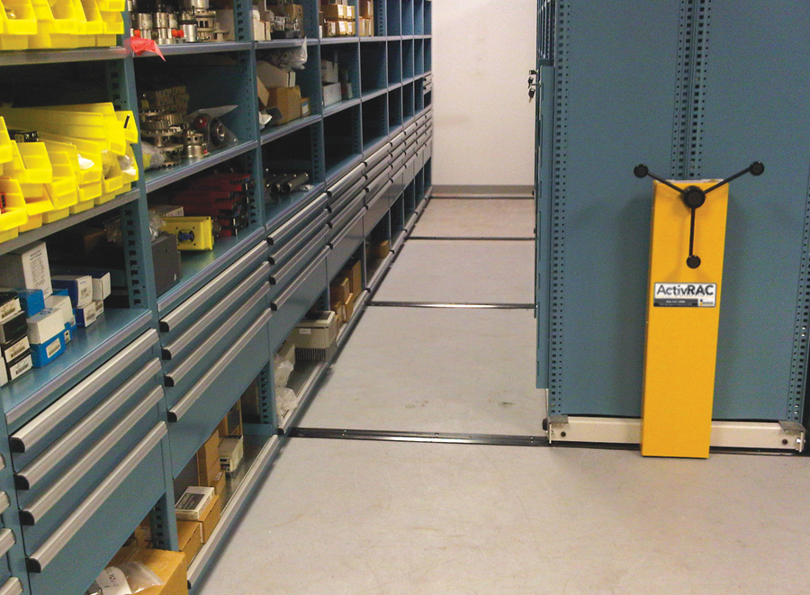 Maintenance part storage in metal shelving on compact storage system