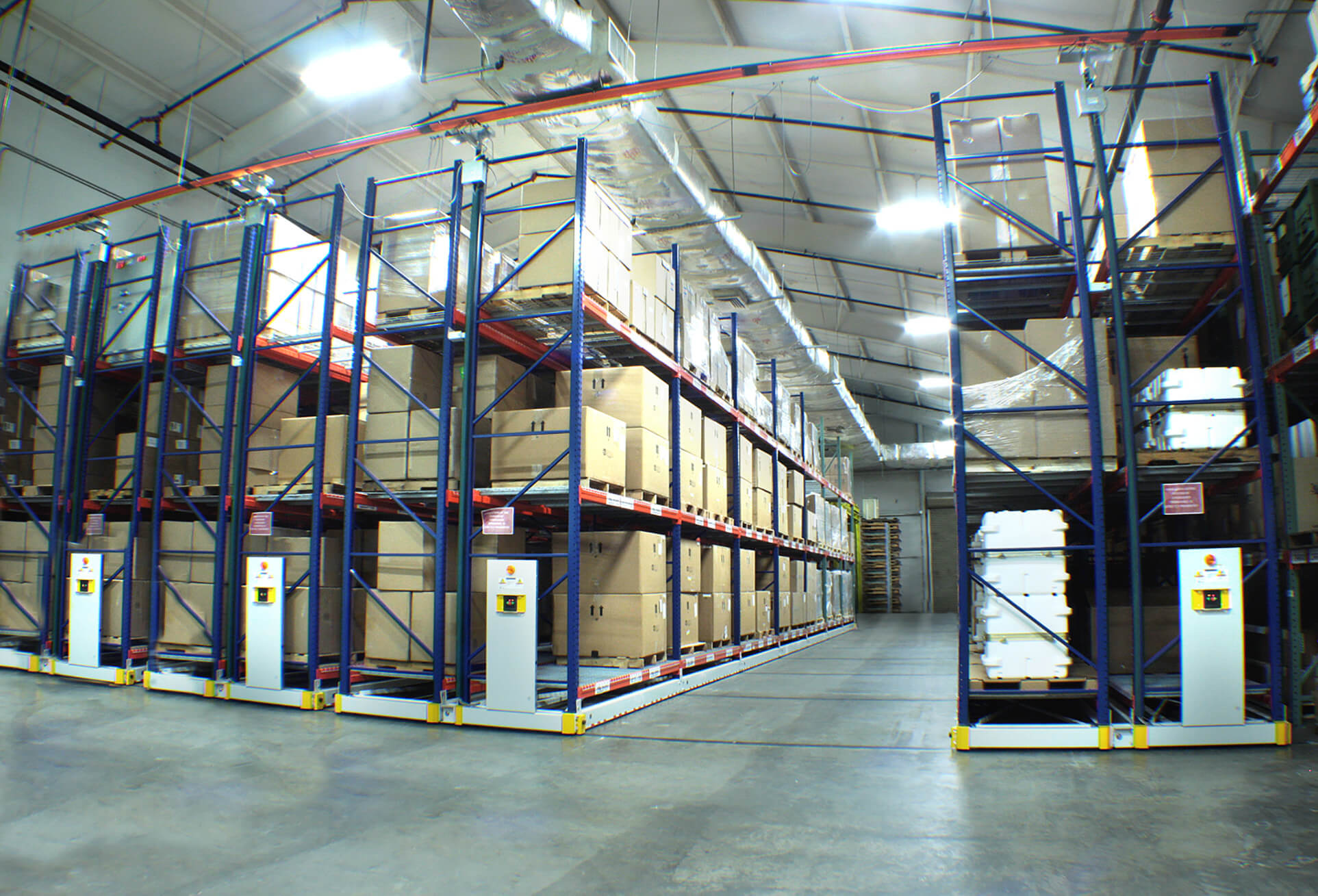 Warehouse materials stored on powered compact racking system