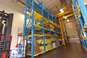 Crane Storage system housing various widgets on adjustable shelving