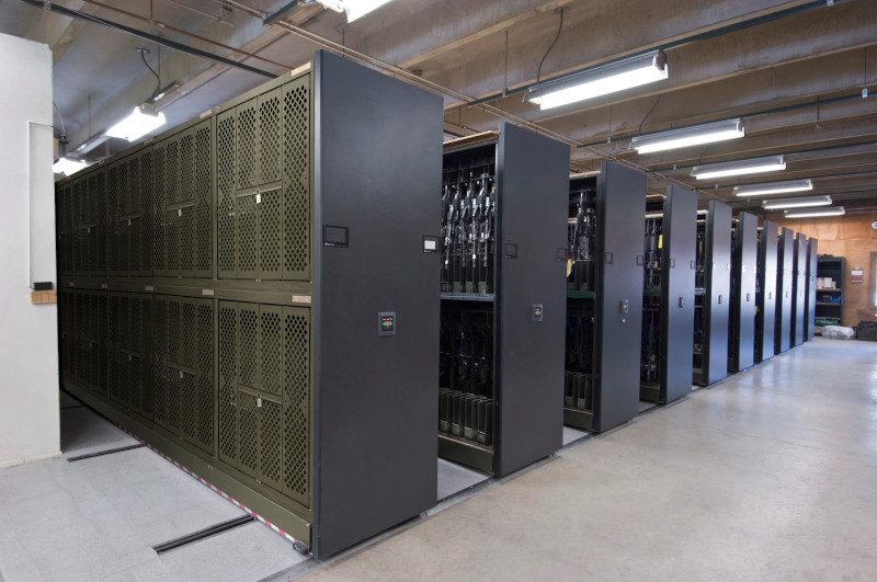 Powered mobile storage system with Universal Weapons rack for secure weapon storage at Military Base